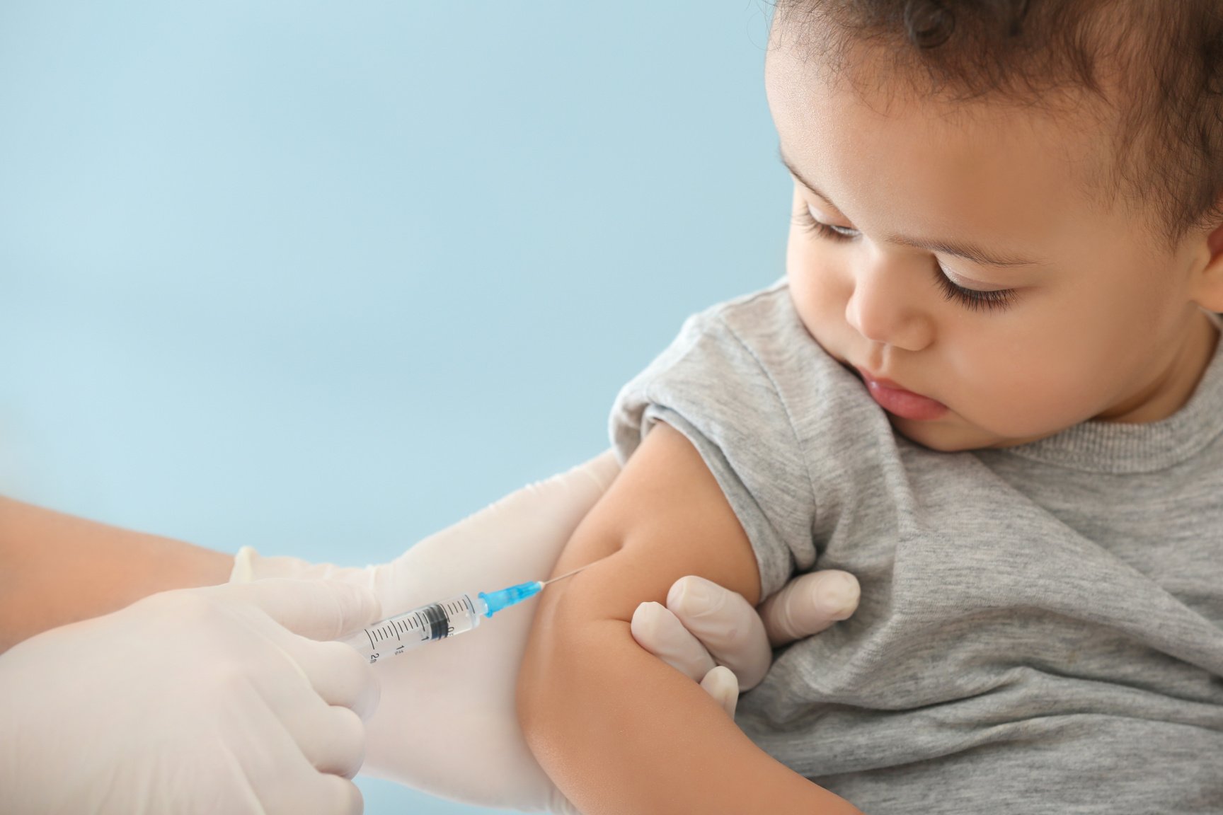 Doctor Vaccinating a Little Baby in the Hospital